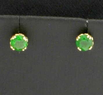 14K Tsavorite Garnet Earrings: In 14K yellow gold, there are two 5mm round Tsavorite Garnet with excellent color and clarity. Stud is 1/4 inch in diameter. They have friction backs. 0.8g
