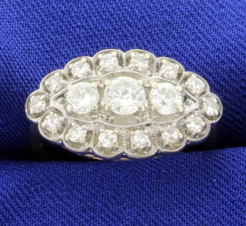 Vintage 1ct Total Weight Diamond Ring: The ring is 14K yellow and white gold and contains one .28, two .15 and fourteen .03ct high quality diamonds, all SI clarity/G color. Size 7 5.0g