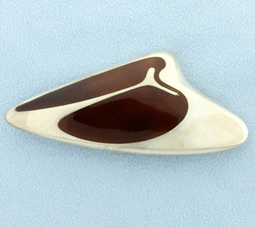 Georg Jensen Sterling Silver Brooch 314: This sterling silver pin is 2 3/4 inches long. Stamped "Georg Jenson sterling Denmark 314". Designed by Henning Koppel. With brown enamel inlay. 20.0g