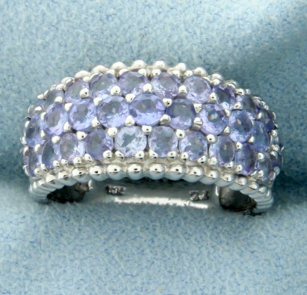 1 1/2 ct TW Tanzanite Ring: In 10K white gold, this ring contains 1 1/2 ct TW of round tanzanite gemstones. Size 7 3.6g