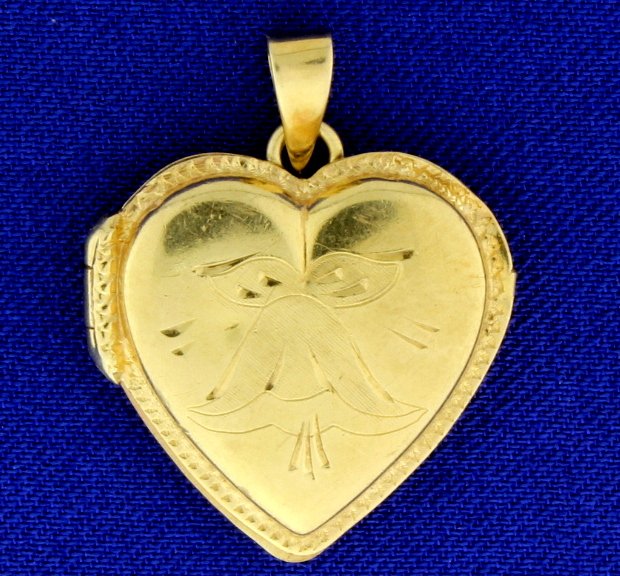 Italian Made Heart Locket: In 14K yellow gold, it can store pictures inside. it is 1 1/8 inch long with bale. 3.6g