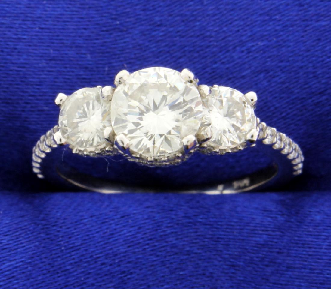 2 Carat TW Three Stone Diamond Ring: The ultimate diamond ring! This 1.80 carat diamond ring has three sparkling diamonds set in 14k white gold. The center brilliant cut diamond is 1.14 carats, clarity SI and color G. The 0.7 carat TW of