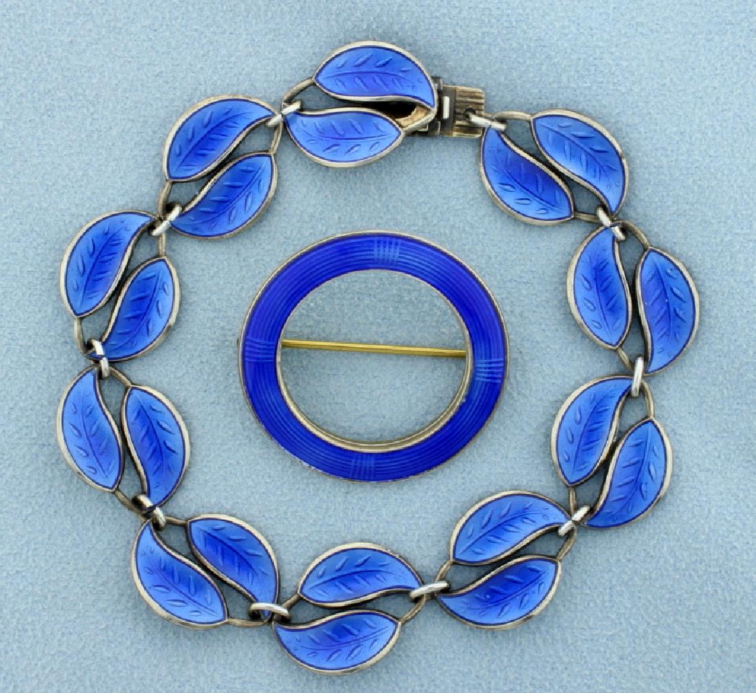 David Andersen Bracelet and Askel Homensen Matching Pin: Enamel on sterling silver, each are made in Norway. The bracelet is 7 1/4 inches long and the pin is 1 1/8 inch in diameter. Bracelet is stamped "D-A" with David Andersen Stamp. Brooch is stamped Norw