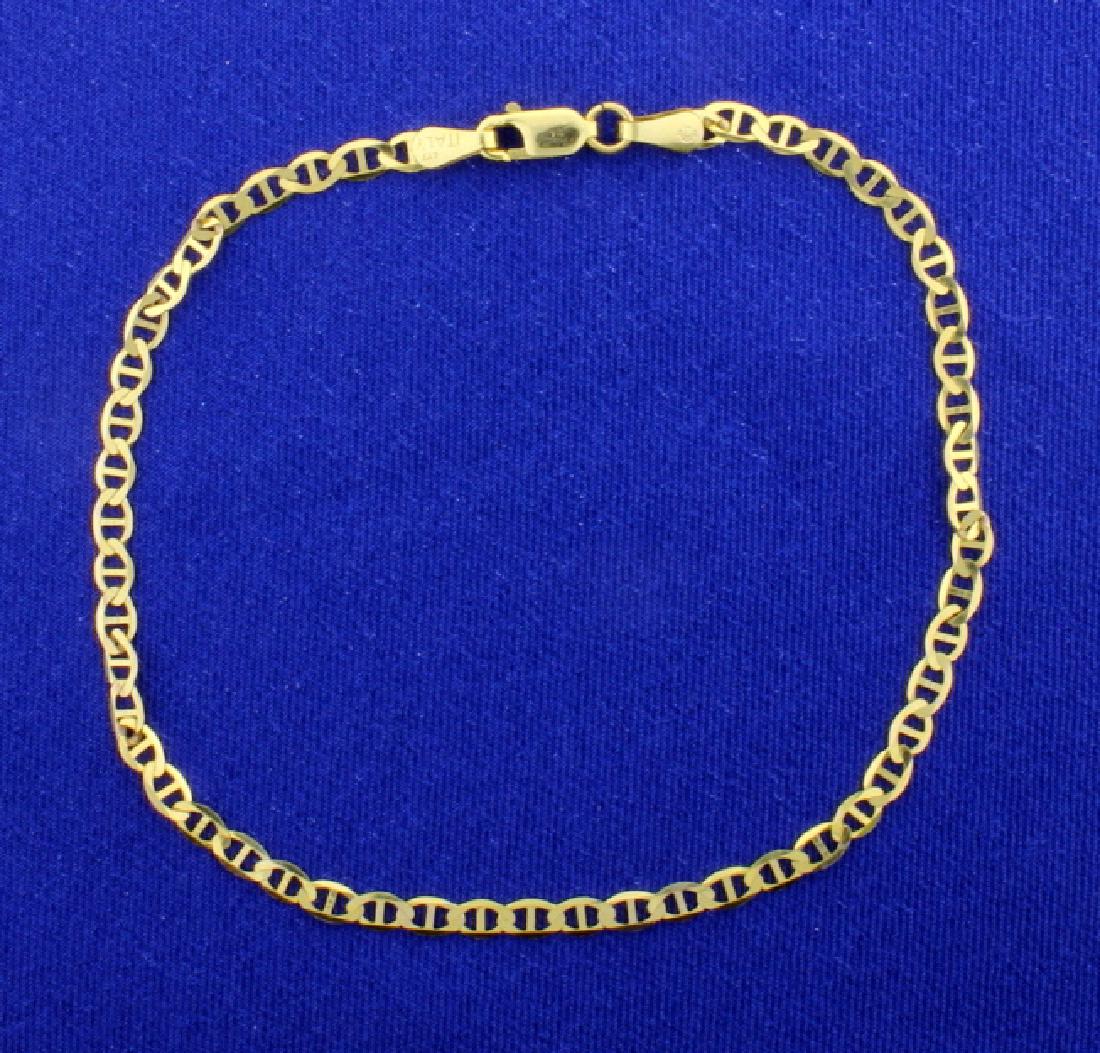 Anchor Chain Anklet: In 10k yellow gold this Italian made anklet is 9 1/4inches long and 3.3mm wide. 2.3g