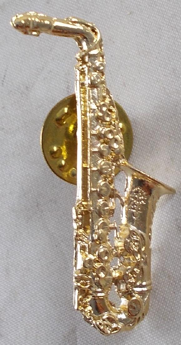 Vintage Bill Clinton saxophone pin. These were sold at: 1 1/2" tall. Excellent. Scarce political collectible.
