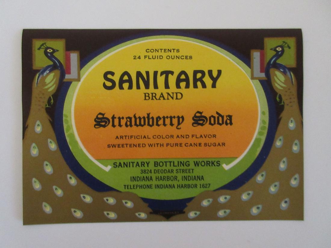 Sanitary Brand Strawberry Soda Bottle Label with: Old phone number "Telephone Indiana Harbor 1627" on the label. Unused stock from the Sanitary Bottling Works building in Indiana Harbor, Indiana. 4 3/4" wide.