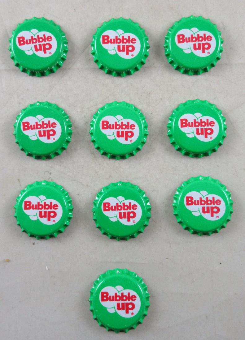Lot of 10 Bubble Up Plastic Lined Soda Caps: Unused old stock in great condition found at the Dad's Root Beer Co. in Jasper, Indiana.