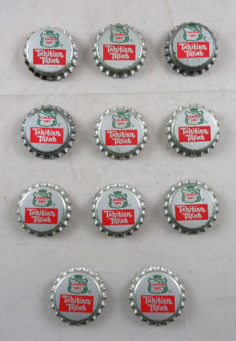 Lot of 11 Vintage cork lined Canada Dry Tahitian Treat: From the Mid-Wisconsin Beverage Company in Wausau, WI and are marked as such. They are unused and in nice shape.