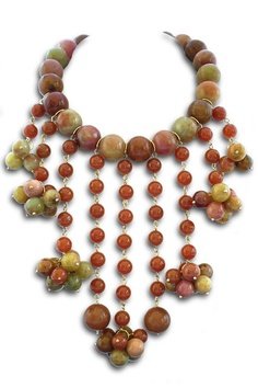 400 CTJADE AND 14KT GOLD 9 STRAND EGYPTIAN BIB NECKLACE: Dramatic Egyptian inspired necklace is composed of a large single strand of marbleized jade with 9 asymetric strands of jade in different lengths. In 14kt gold.