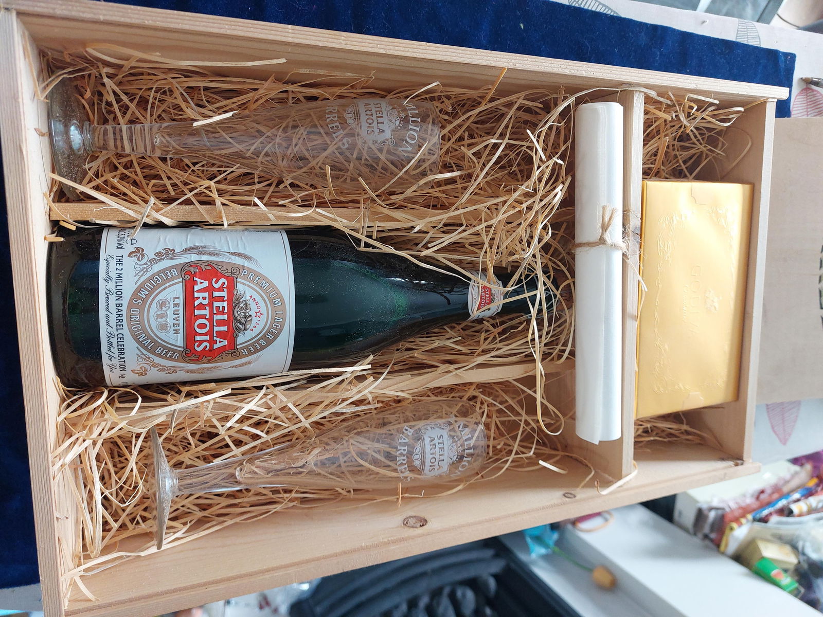 Commemorative Bottle of Stella: Title: Commemorative Bottle of Stella Description: Commemorative large bottle of Stella Artois complete with 2 champagne flutes. The box of chocolates is still intact makin