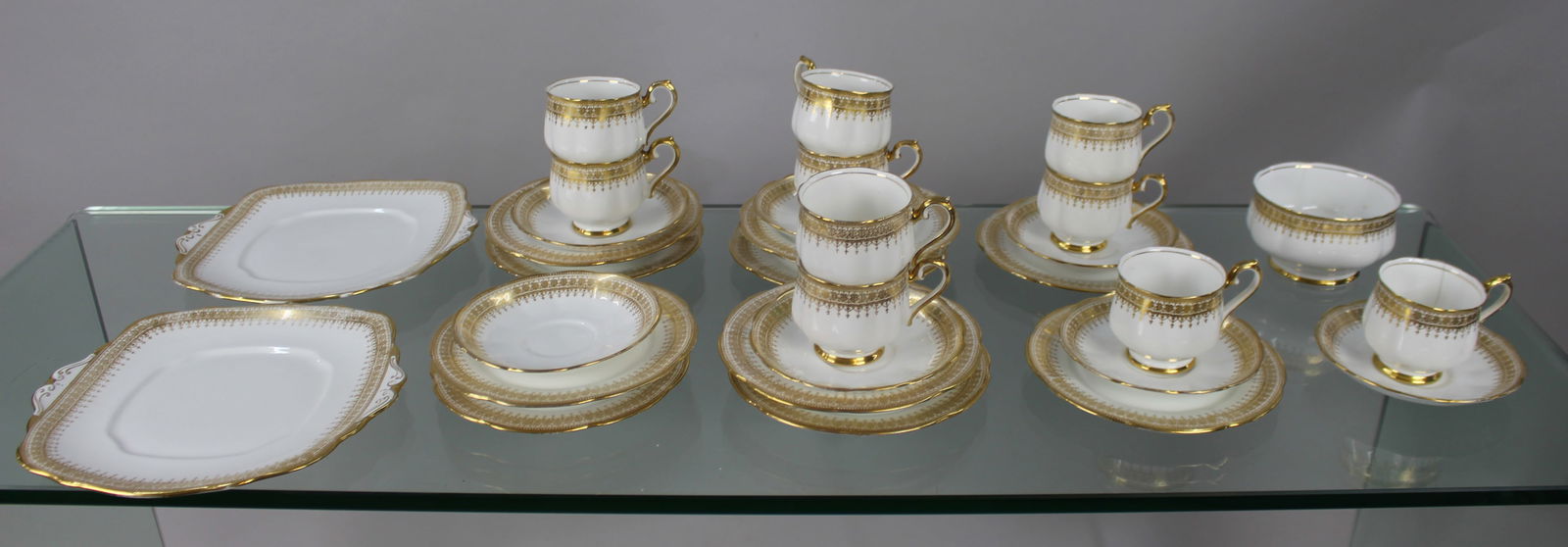 Royal Albert White & Gold Tea Service: Title:Royal Albert White & Gold Tea Service Description: Royal Albert White & Gold Tea Service Vintage, 20th century. All 34 pieces as pictured; 2 cake plates, 10 tea cups, 1
