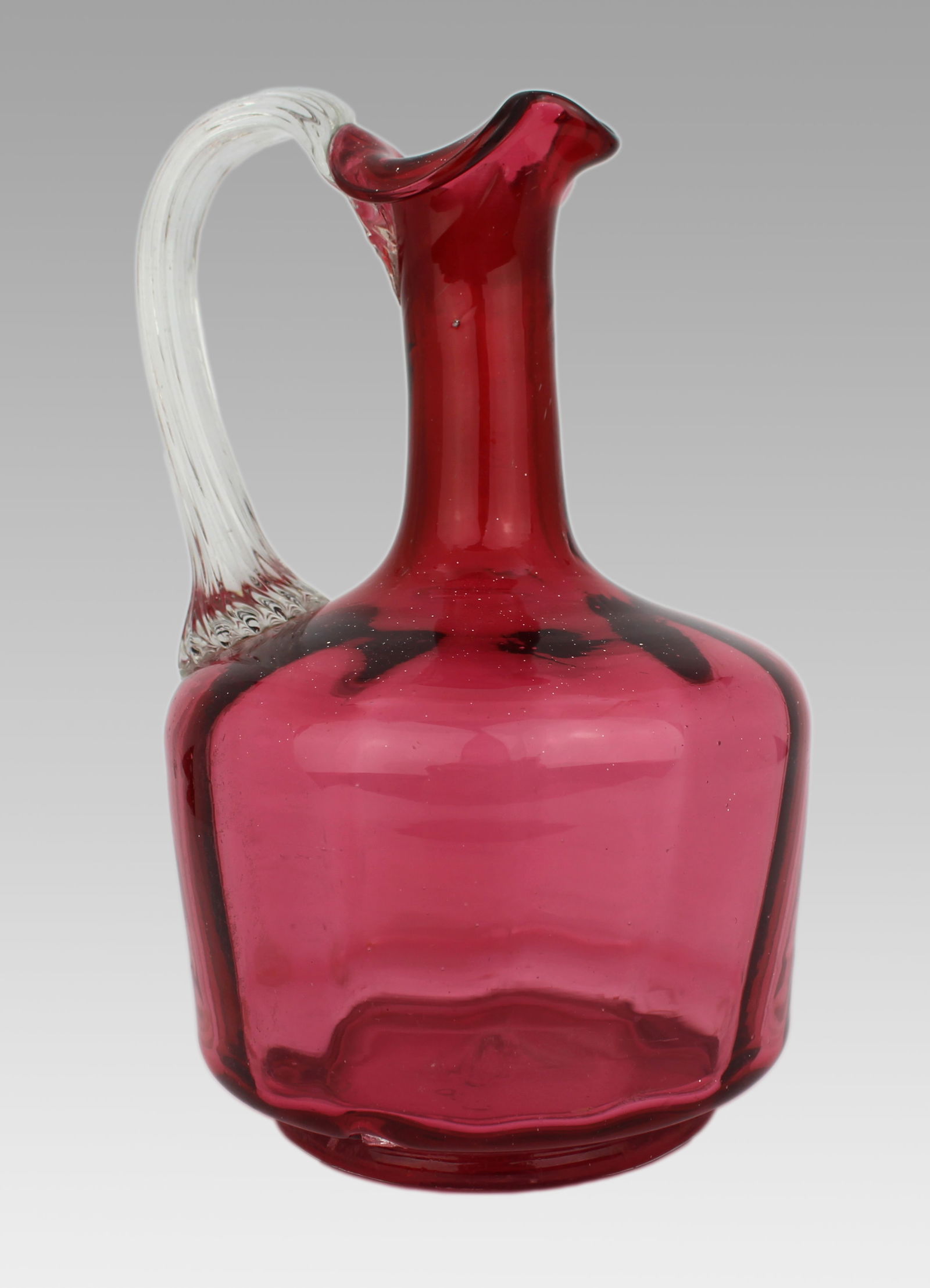 Victorian Cranberry Glass Jug: Title:Victorian Cranberry Glass Jug Description: Victorian Cranberry Glass Jug A good quality Victorian hand-blown cranberry glass jug. The jug of rich cranberry glass, with an applied clear glass