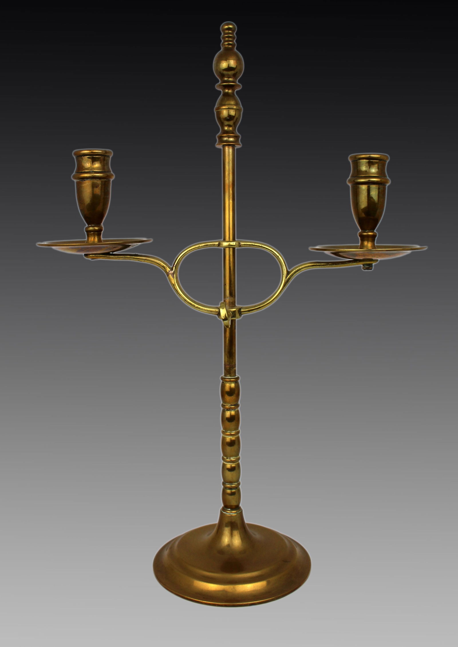 Vintage Adjustable Brass Twin-Arm Candelabra: Title:Vintage Adjustable Brass Twin-Arm Candelabra Description: Vintage Adjustable Brass Twin-Arm Candelabra, Mid-20th Century A handsome and well-proportioned brass candelabra featuring t