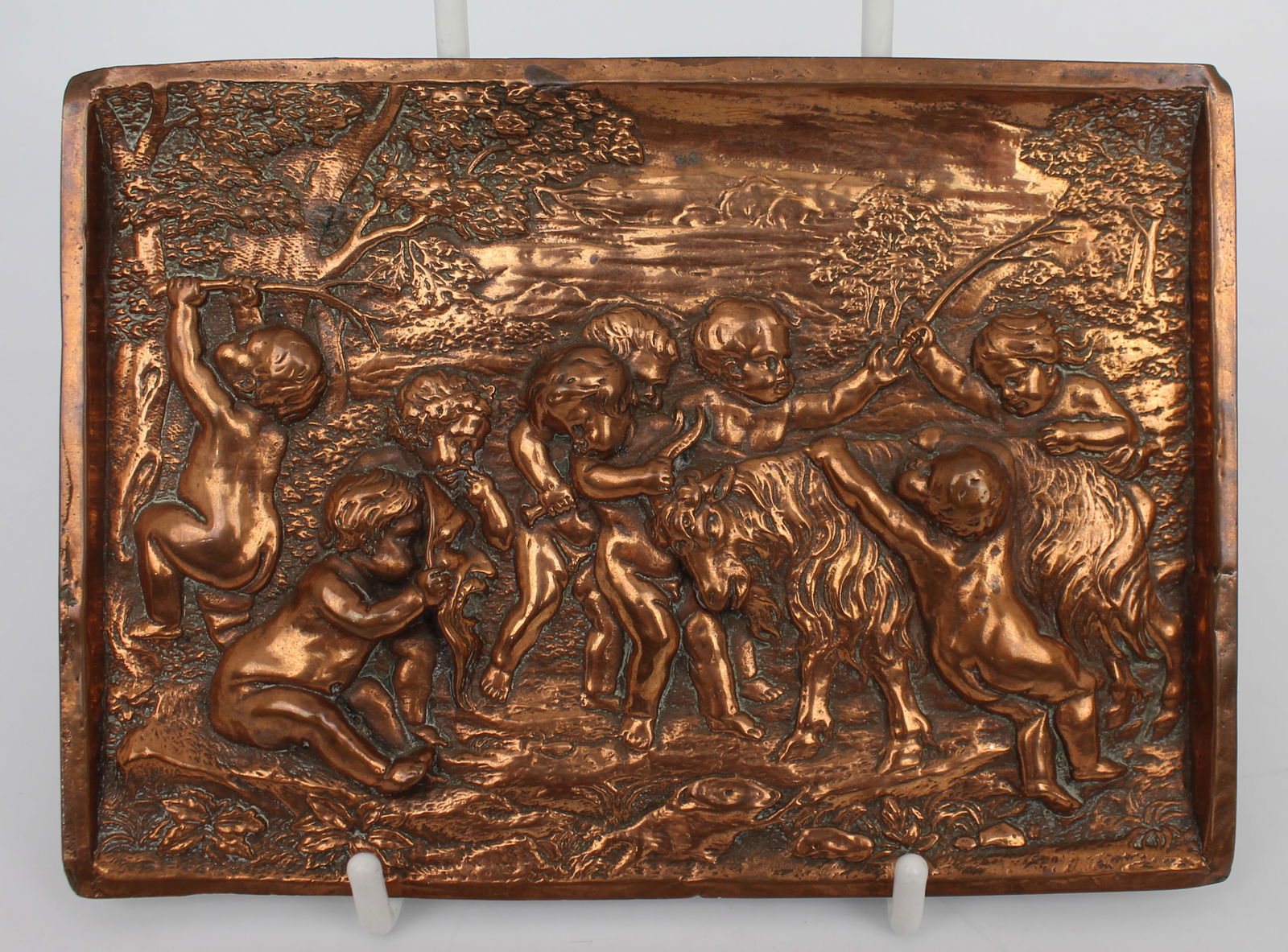 Italian Copper Relief Plaque Depicting Putti: Title:Italian Copper Relief Plaque Depicting Putti Description: Italian Copper Relief Plaque Depicting Putti Mid-20th Century, Italian A decorative copper repoussé plaque depicting a group of