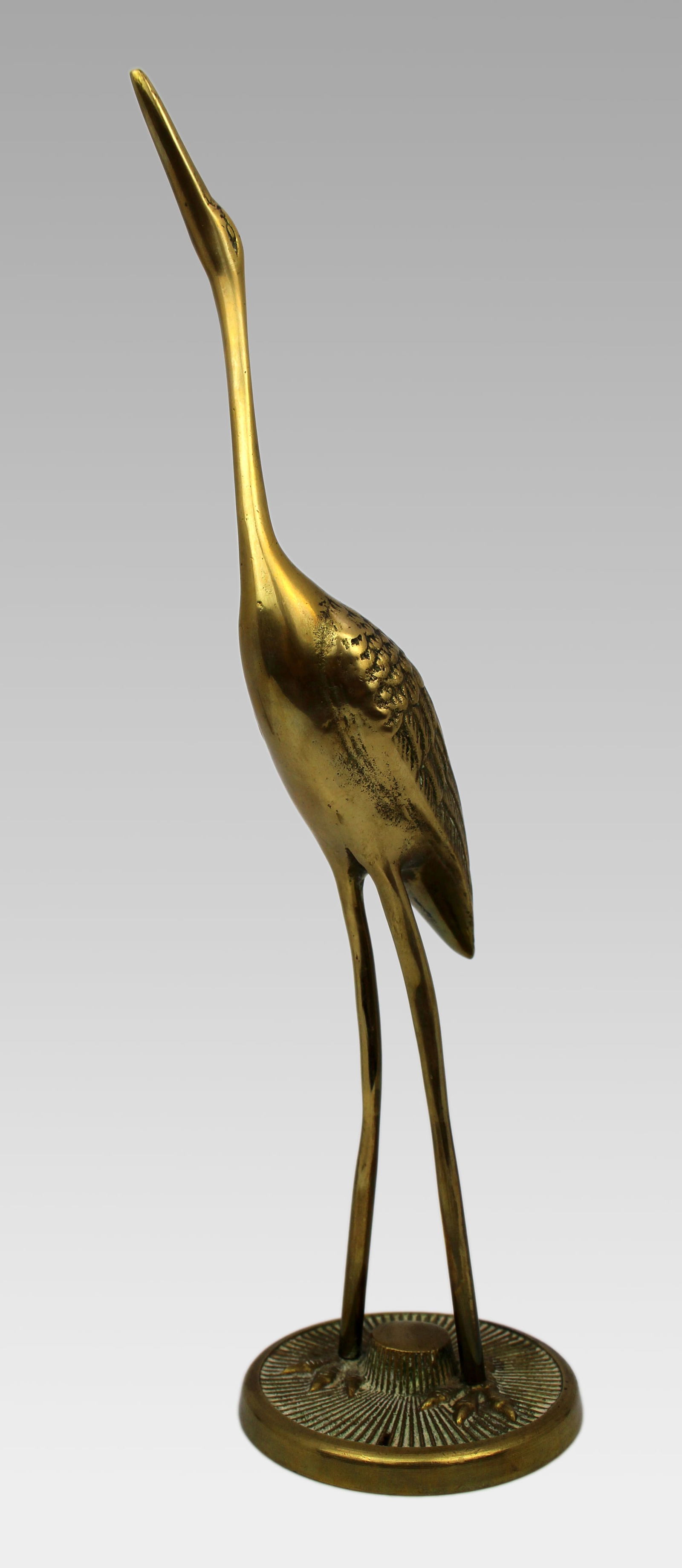 Mid-20th Century Brass Crane Sculpture: Title:Mid-20th Century Brass Crane Sculpture Description: Mid-20th Century Brass Crane Sculpture A tall and elegant brass sculpture of a crane or heron, likely mid-20th century. The bird is