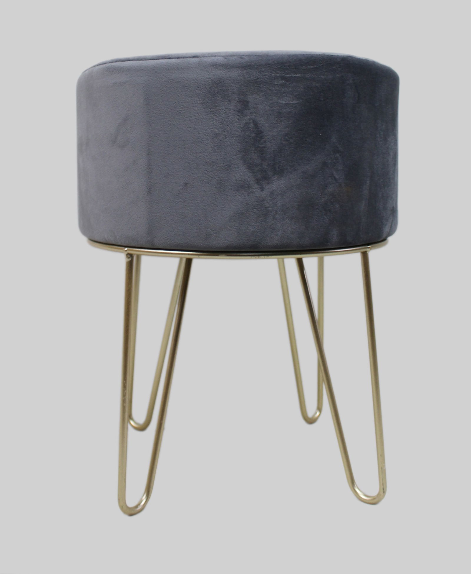 Grey Velvet Stool with Gold Hairpin Legs: Title:Grey Velvet Stool with Gold Hairpin Legs Description: Grey Velvet Stool with Gold Hairpin Legs A compact, modern stool with a round, grey velvet-covered seat and gold-tone metal hairpin legs. 