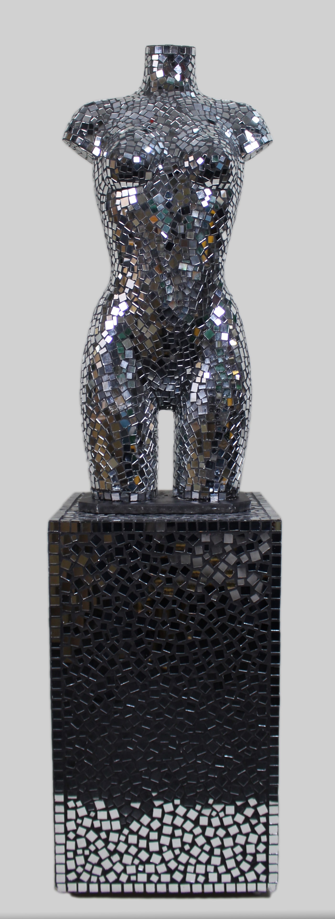 Mirrored Mannequin Torso on Pedestal: Title:Mirrored Mannequin Torso on Pedestal Description: Contemporary Mirrored Mosaic Female Torso Sculpture on Pedestal A striking decorative sculpture of a female torso, entirely clad in mirrored