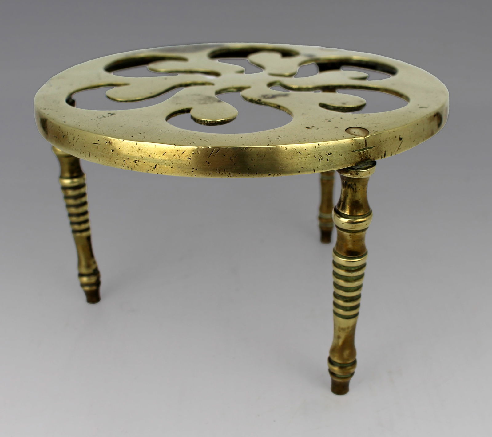 Vintage Brass Trivet: Title:Vintage Brass Trivet Description: Vintage Brass Trivet Condition: Used Location Category: Antiques