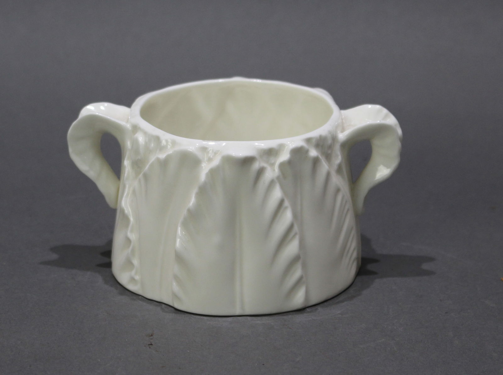 Royal Worcester Two Handled Leaf Jug: Title:Royal Worcester Two Handled Leaf Jug Description: Royal Worcester porcelain. 1960's. Measures 12 x 9 x 6 (h) cm. Full first quality green factory mark to underside. Very good condition; no