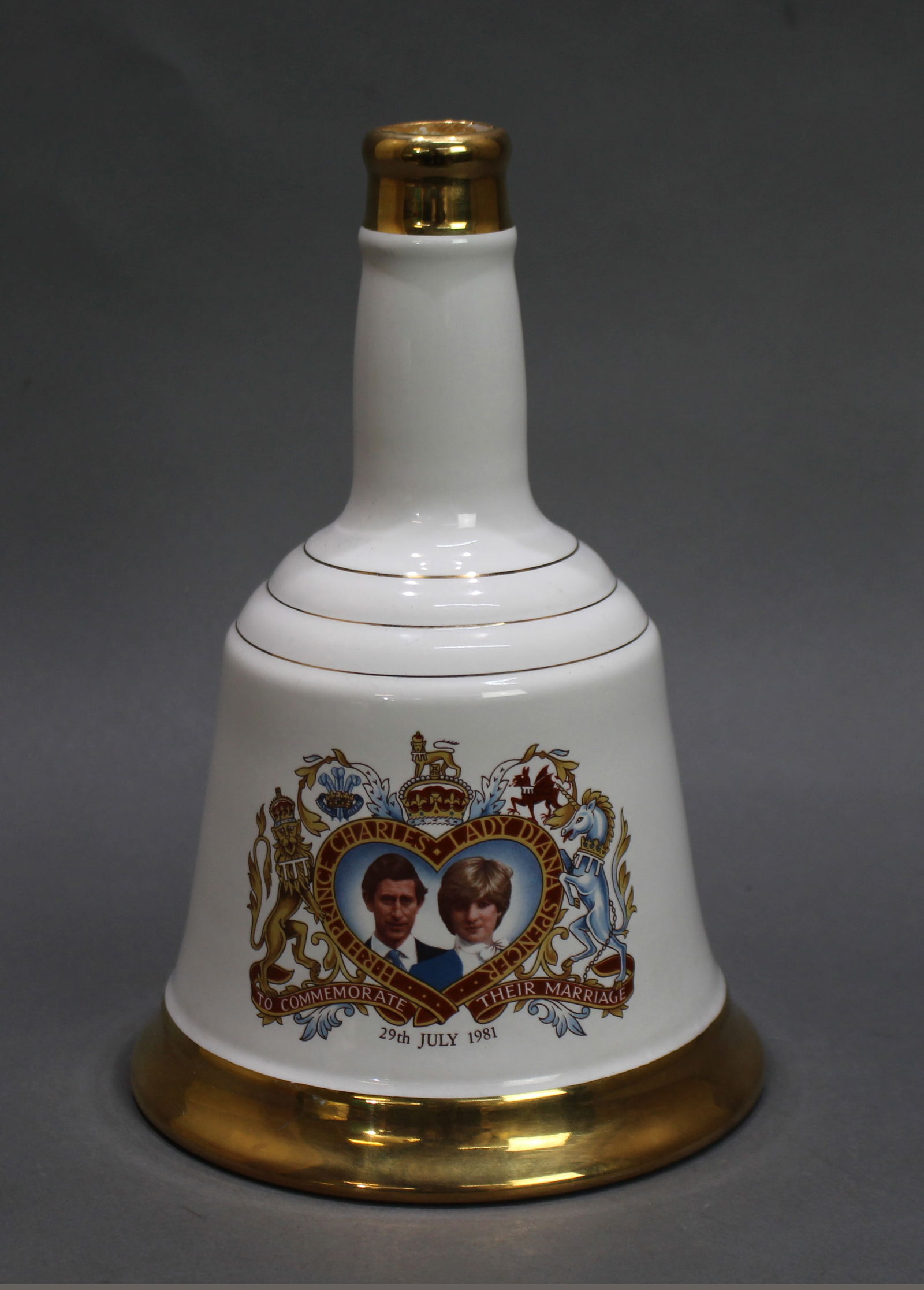 Commemorative Bell's Scotch Whisky 1981: Title:Commemorative Bell's Scotch Whisky 1981 Description: Commemorative porcelain decanter from Bell's Scotch Whisky. To commemorate the marriage of Charles & Diana 1981. Full; no seal to top