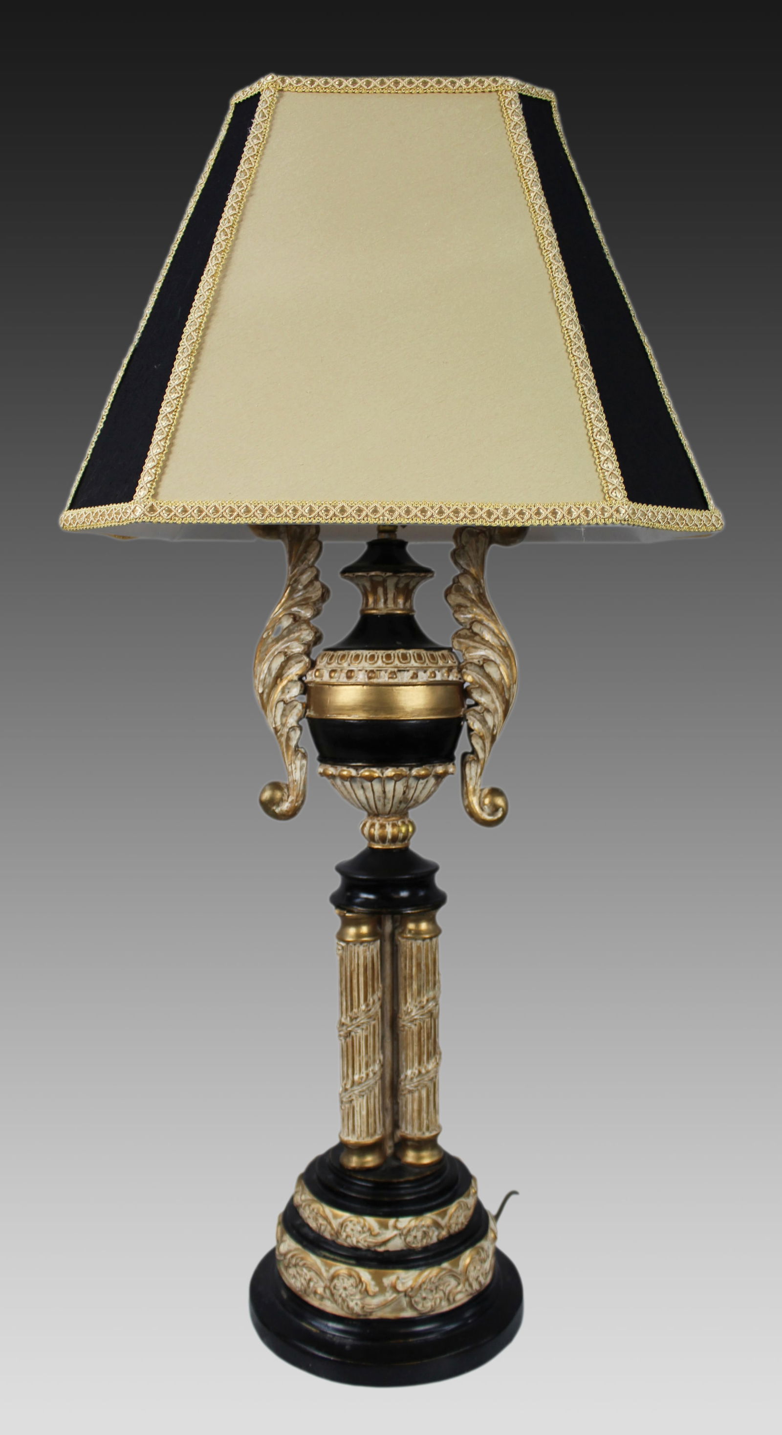 Neoclassical Style Giltwood and Ebonised Table Lamp: Title:Neoclassical Style Giltwood and Ebonised Table Lamp Description: Neoclassical Style Table Lamp with Gilt and Ebonised Finish A tall and decorative neoclassical revival table lamp, dating from