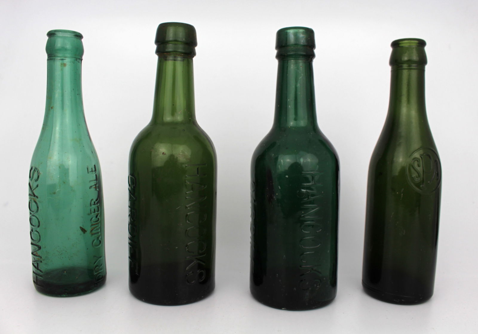 Collection of 4 Bottle Hancock's Spa: Title: Collection of 4 Bottle Hancock's Spa Description: Collection of 4 Bottle Hancock's Spa. Approximately 20 cm in height Condition: Used Location Category: Antiques"