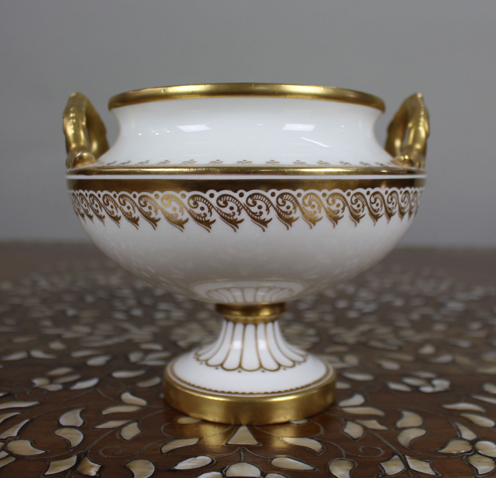 19th Century English White & Gilt Two-Handled Porcelain Urn: Title: 19th Century English White & Gilt Two-Handled Porcelain Urn Description: 19th Century English White & Gilt Two-Handled Porcelain Urn A well-made English porcelain urn fro