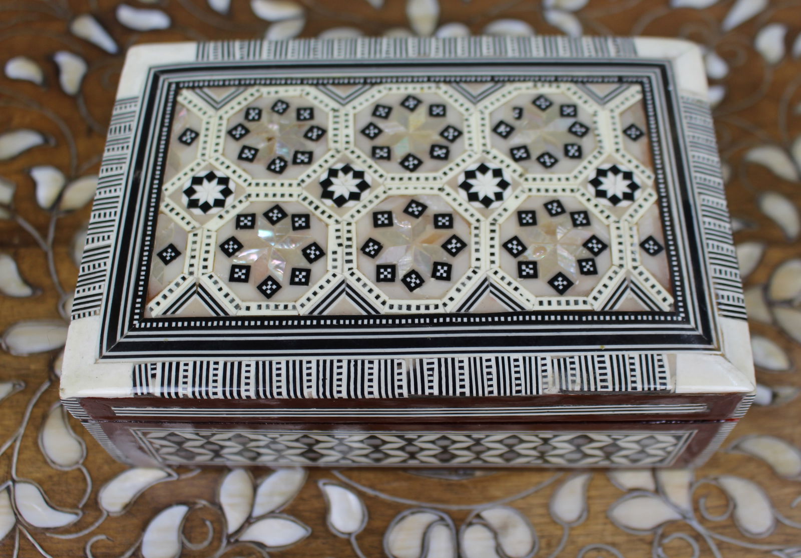 Decorative Inlaid Mother-of-Pearl and Bone Box: Title: Decorative Inlaid Mother-of-Pearl and Bone Box Description: Decorative Inlaid Mother-of-Pearl and Bone Box A finely made wooden box decorated throughout with intricate geometric