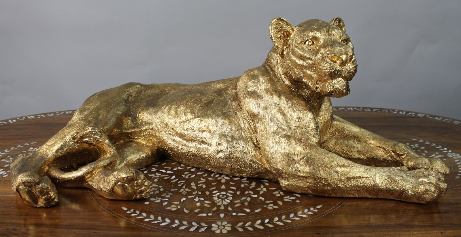 Large Reclining Lioness Sculpture Resin with Hand-Applied Gold Leaf Finish: Title: Large Reclining Lioness Sculpture Resin with Hand-Applied Gold Leaf Finish Description: Large Reclining Lioness Sculpture Hand-Applied Gold Leaf over Resin Body A