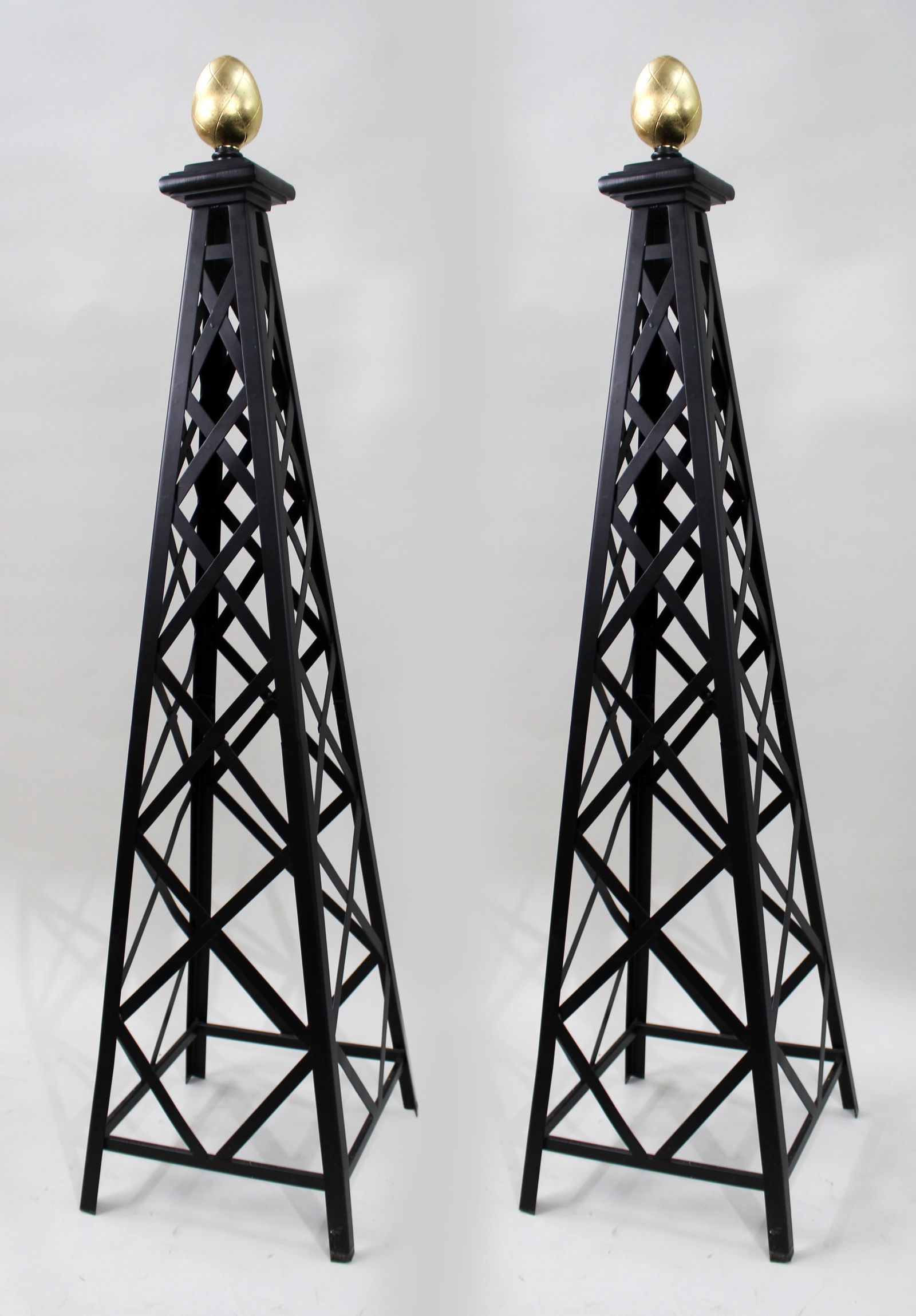 Pair of 5ft Black & Gold Metal Architectural Obelisks: Title: Pair of 5ft Black & Gold Metal Architectural Obelisks Description: Pair of Contemporary Black and Gold Architectural Obelisks Offered for sale is a striking pair of contempo