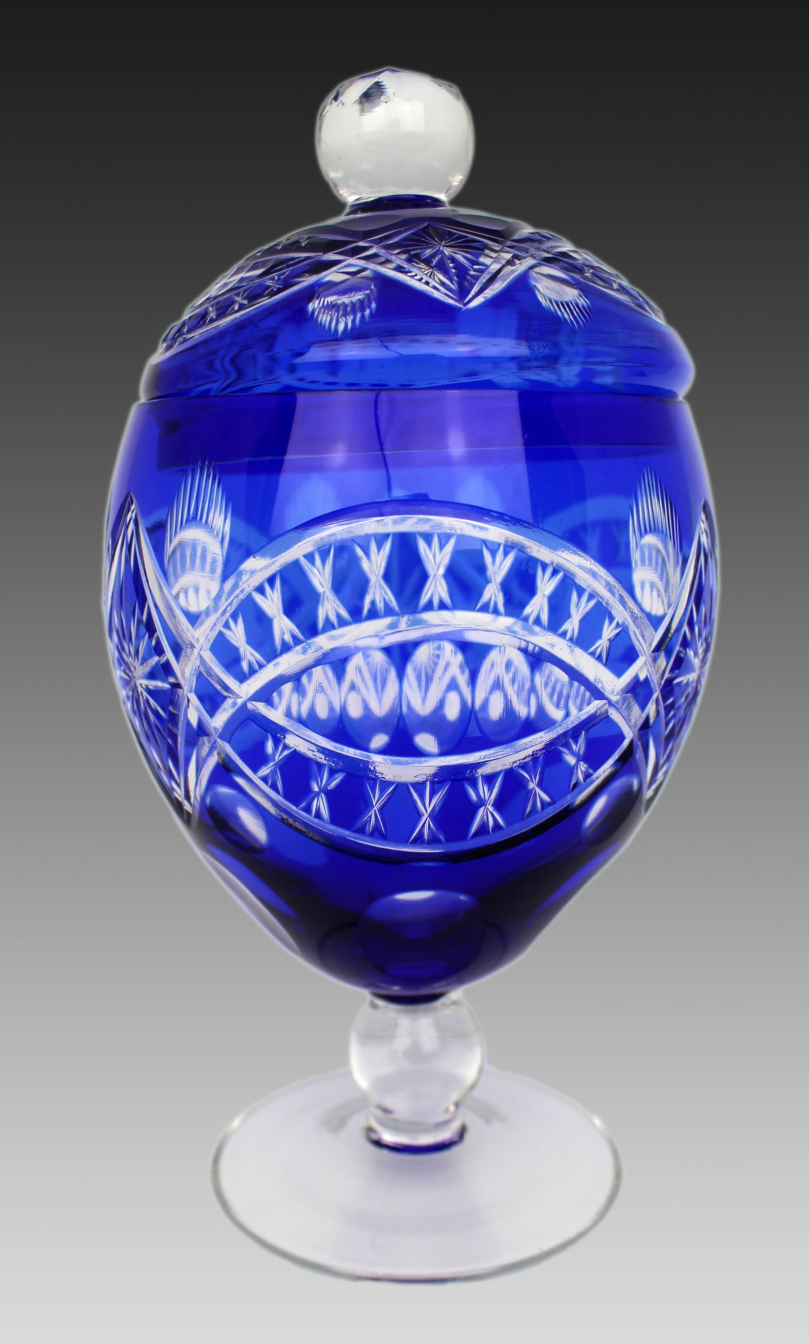 Blue Overlay Cut Crystal Lidded Sweet Dish: Title: Blue Overlay Cut Crystal Lidded Sweet Dish Description: Blue Overlay Cut Crystal Lidded Sweet Dish A blue overlay cut crystal lidded sweet dish of goblet form, dating to the lat