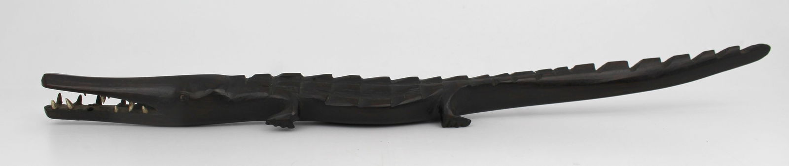 Antique African Hardwood Sculpture of Crocodile: Title: Antique African Hardwood Sculpture of Crocodile Description: Antique African Hardwood Sculpture of Crocodile. Measures 3.5 x 35 x 2 (height) cm. Old condition; one foot miss