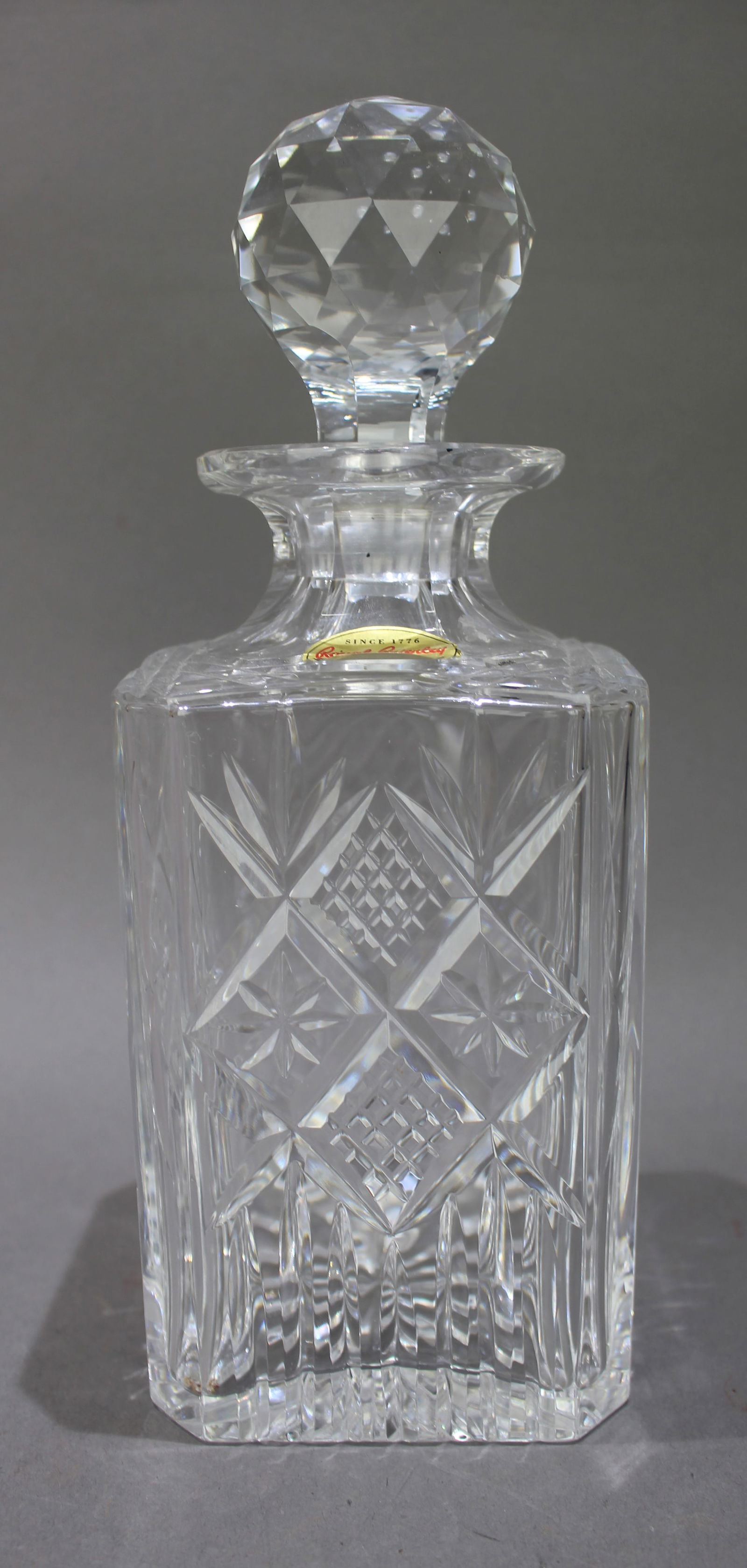 Vintage Royal Brierley Crystal Square Shaped Spirit Decanter: Title: Vintage Royal Brierley Crystal Square Shaped Spirit Decanter Description: Vintage Cheviot British Crystal Square Shaped Spirit Decanter. Factory label to decanter. Measures