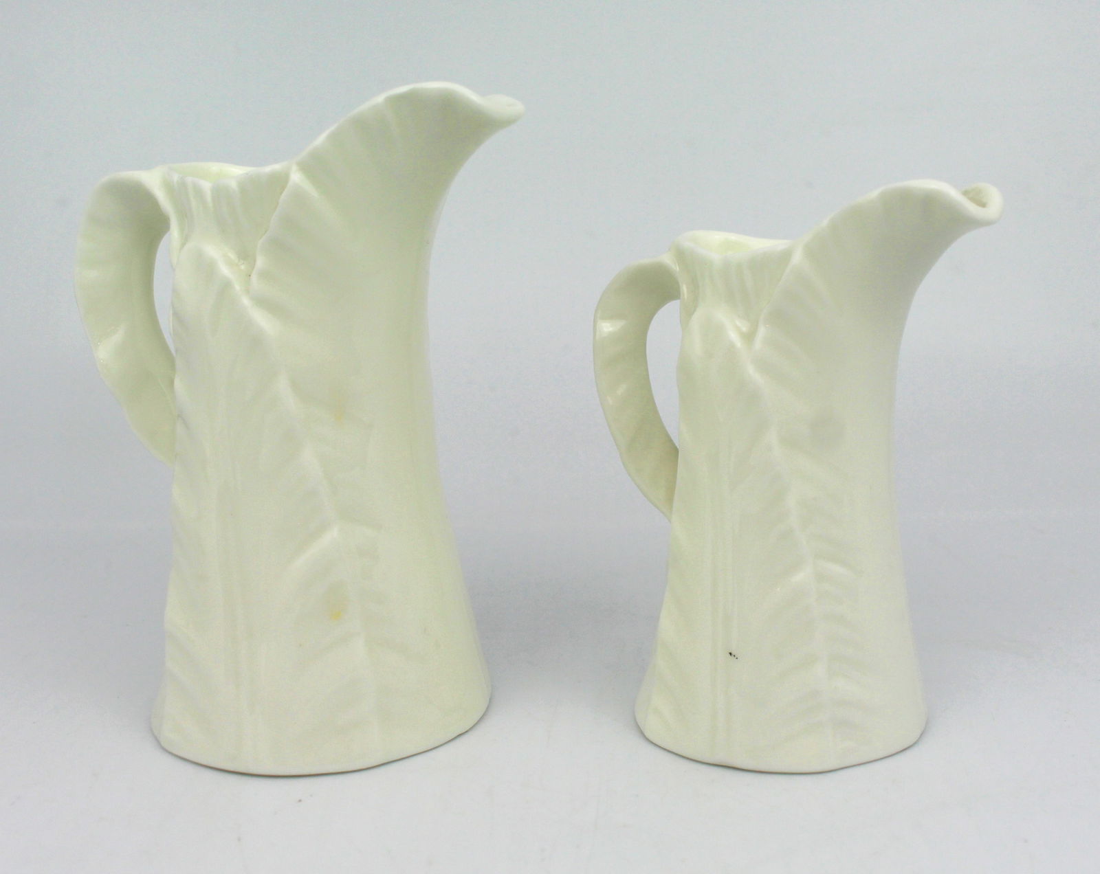 Pair of Royal Worcester Leaf Jugs: Title: Pair of Royal Worcester Leaf Jugs Description: Royal Worcester backstamp to one, the other without Condition: Used Location Category: Antiques"