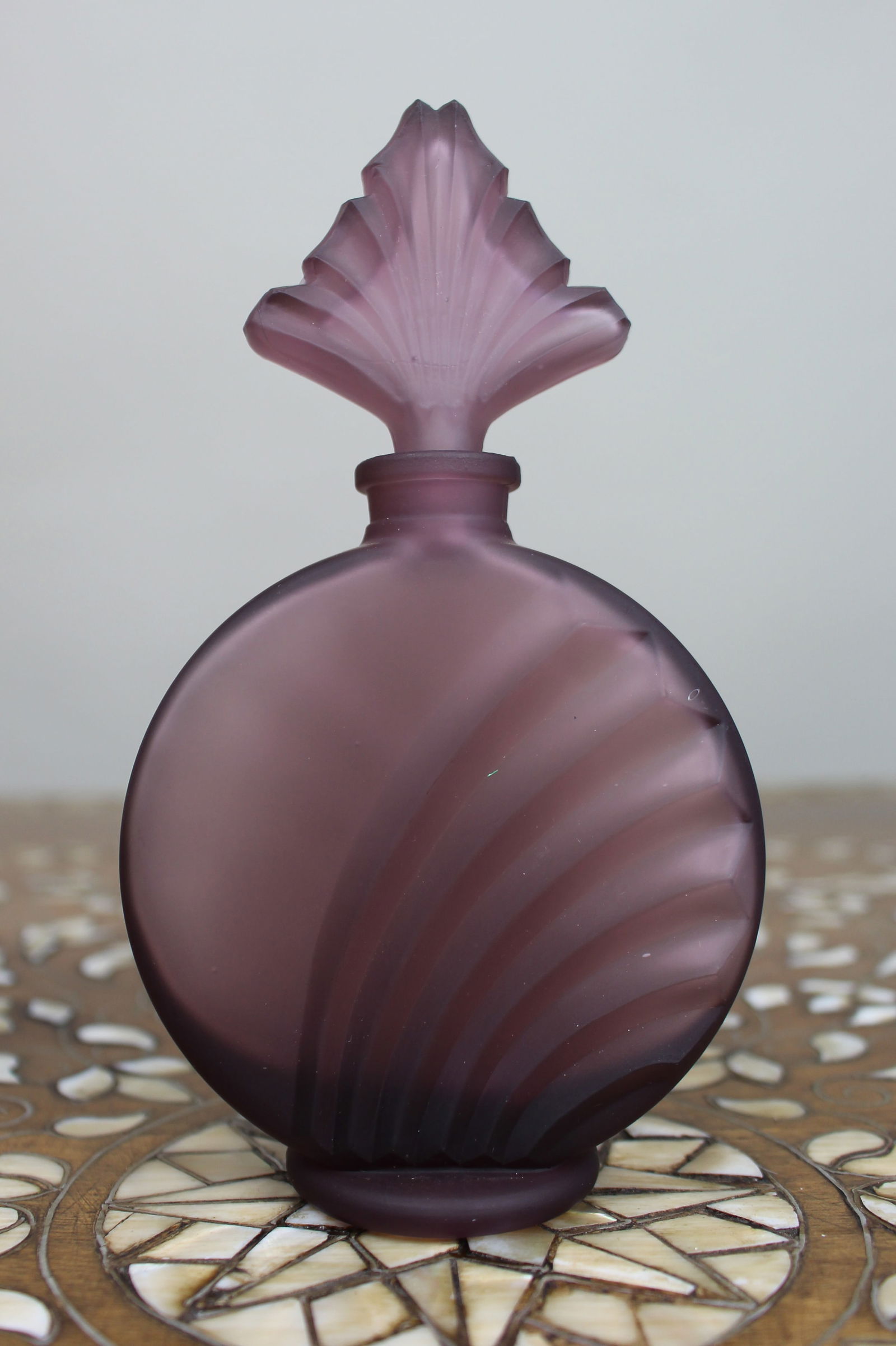 Frosted Purple Glass Scent Bottle: Title: Frosted Purple Glass Scent Bottle Description: Frosted Purple Glass Scent Bottle A decorative modern frosted glass scent bottle in a soft purple tone, of circular form with moulded