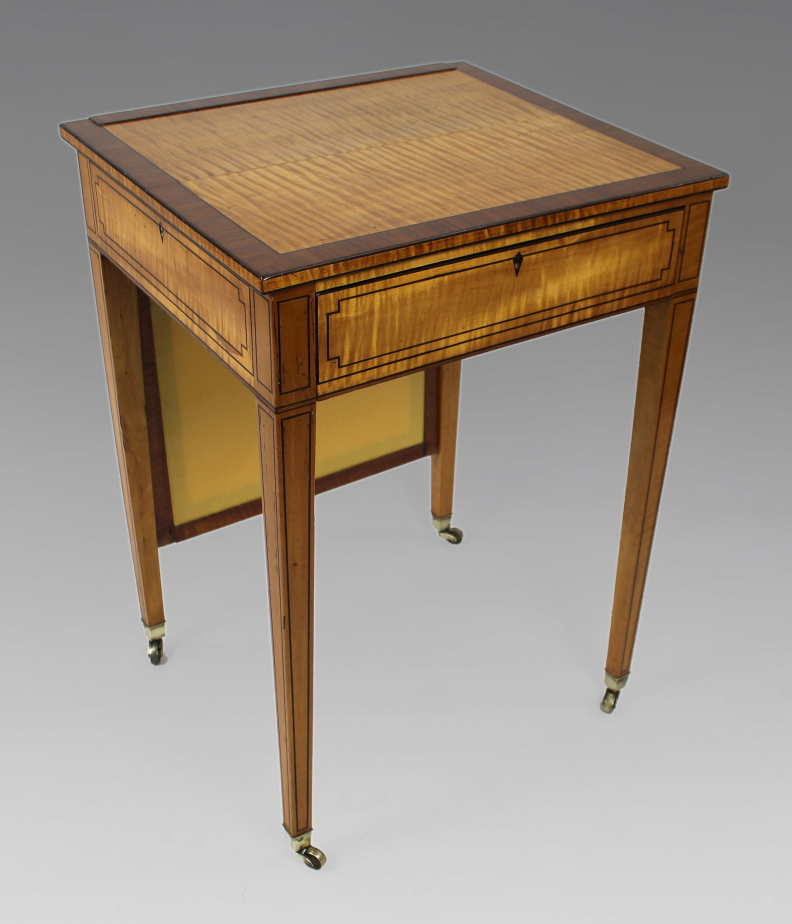 George III Sheraton Satinwood Writing Table: Title: George III Sheraton Satinwood Writing Table Description: George III Sheraton Satinwood Writing Table, c.1810 English – Early 19th Century A fine quality George I