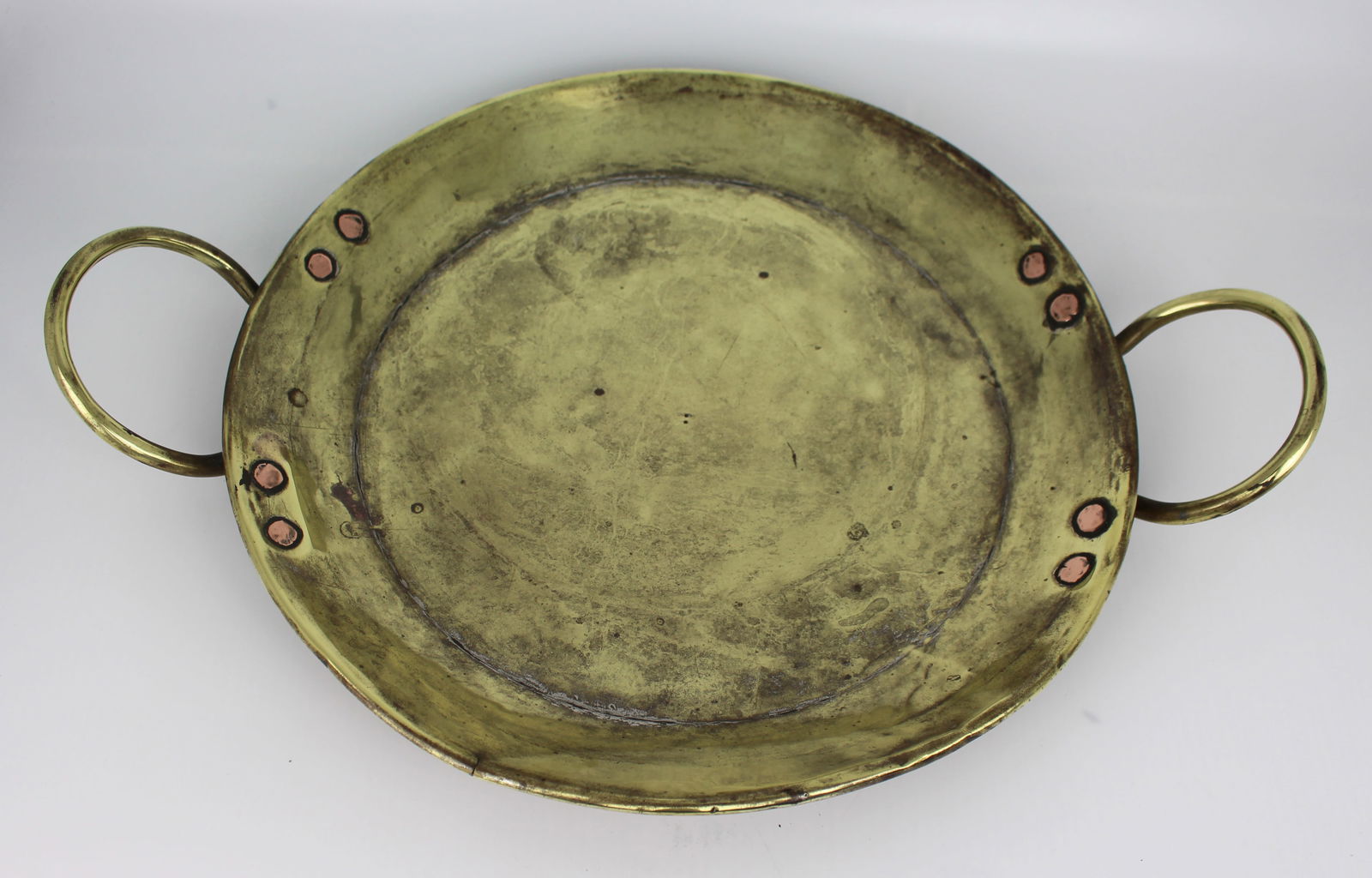Antique Brass Two Handled Dish: Title: Antique Brass Two Handled Dish Description: Antique Brass Two-Handled Dish – 19th Century A characterful antique brass dish, of shallow oval form with two ring handles.