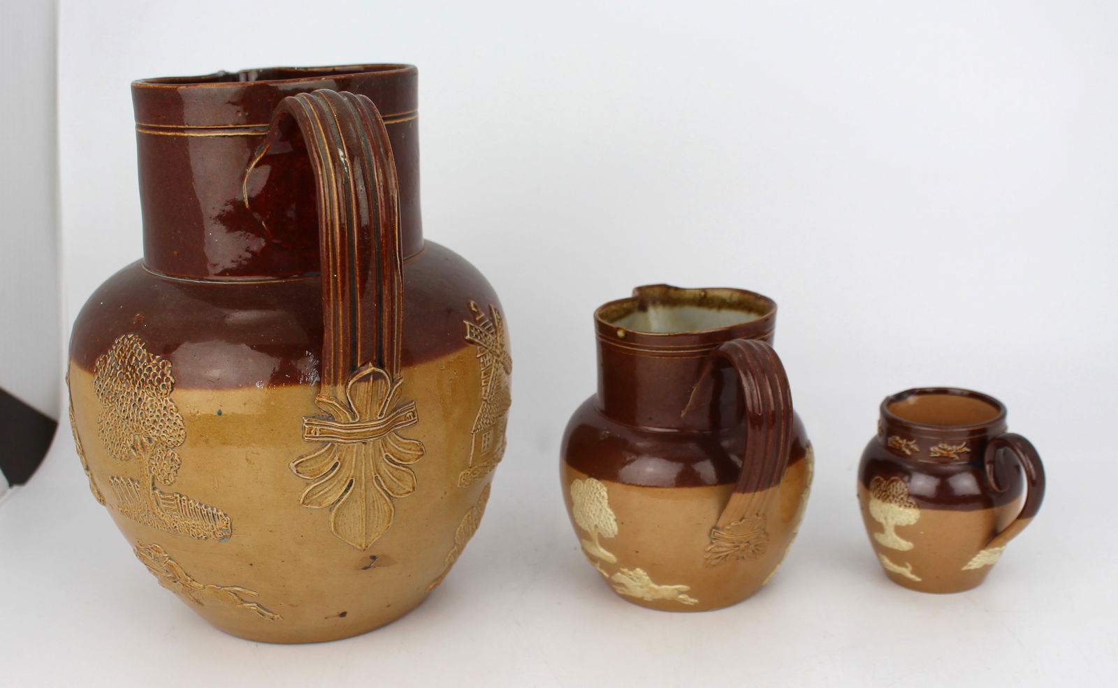 Collection of Three Graduated Doulton Lambeth Stoneware Jugs, c.1900 - 11