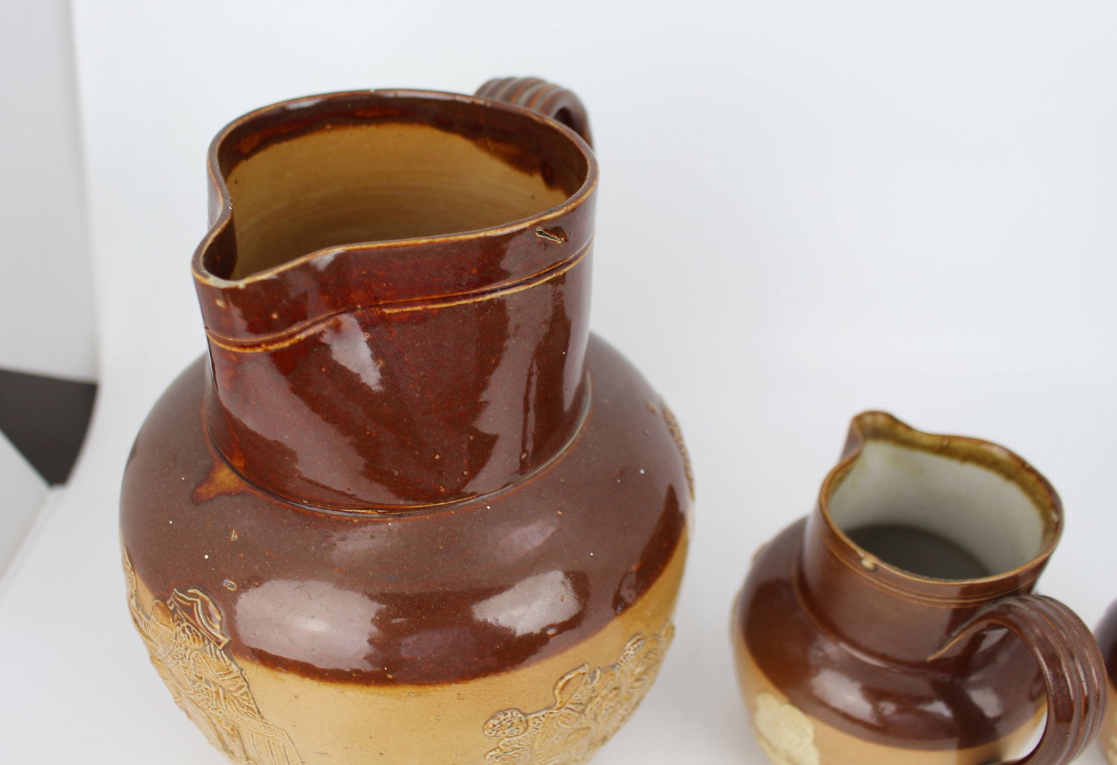 Collection of Three Graduated Doulton Lambeth Stoneware Jugs, c.1900 - 12