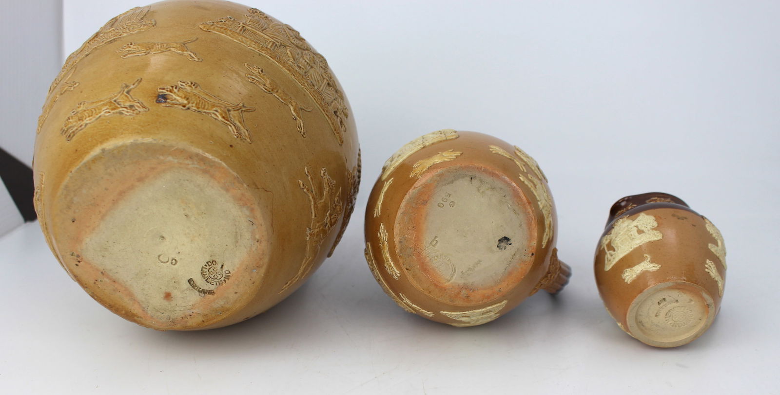 Collection of Three Graduated Doulton Lambeth Stoneware Jugs, c.1900 - 14