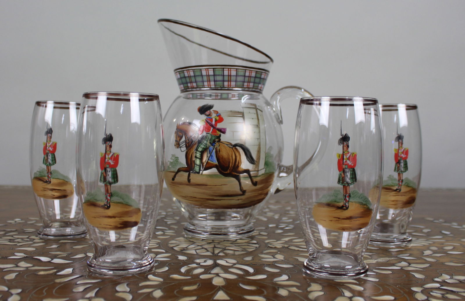 Vintage Highland Soldiers Water Jug & Glasses Set: Title: Vintage Highland Soldiers Water Jug & Glasses Set Description: Vintage Highland Soldiers Water Jug & Glasses Set A vintage glass water jug with four matching tumblers, each