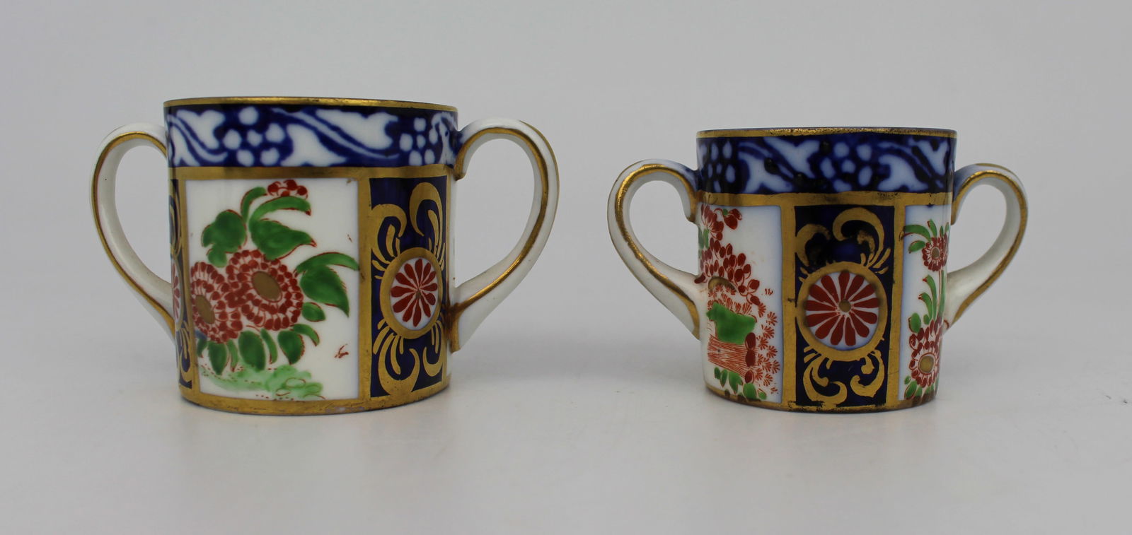 Pair of New Chelsea Staffs Miniature Two Handled Cups c.1920: Title: Pair of New Chelsea Staffs Miniature Two Handled Cups c.1920 Description: Pair of New Chelsea Staffordshire Miniature Two-Handled Cups | c.1920 A graduated pair of miniature two-handled