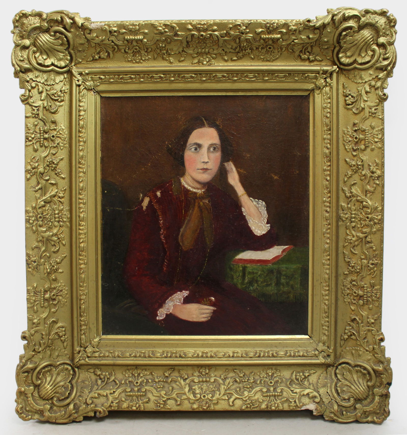 Victorian Portrait Oil on Canvas Set in Heavy Gilt Frame: Title: Victorian Portrait Oil on Canvas Set in Heavy Gilt Frame Description: Victorian Oil Portrait of a Lady in Burgundy Dress, Circa 1884 A Victorian portrait of a young lady, rendere
