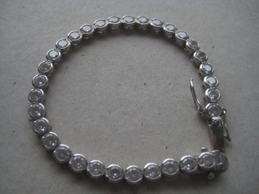 Vintage Sterling Silver Paste Stone Set Tennis Bracelet: Title: Vintage Sterling Silver Paste Stone Set Tennis Bracelet Description: Vintage Sterling Silver Paste Stone Set Tennis Bracelet. Stamped 925. Length is 7 Inches. Weight