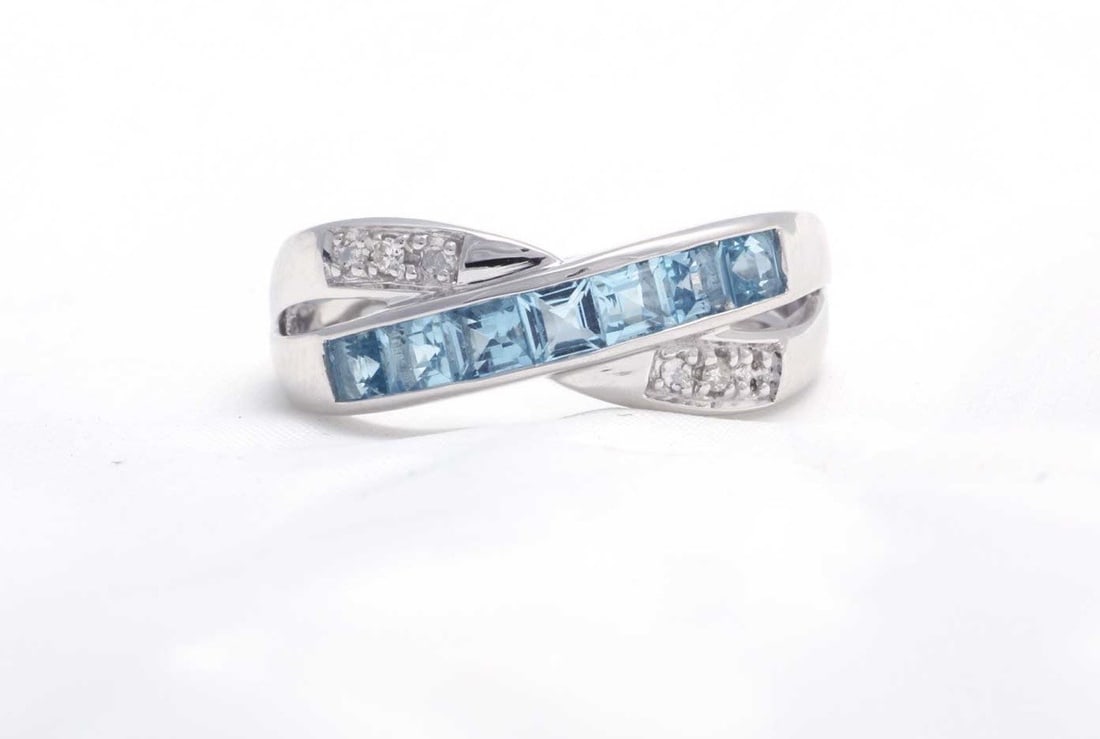 This Twist On A Classic Ring Is Stunning. Seven Beautiful Princess Cut Blue Topaz Gemstones - 2