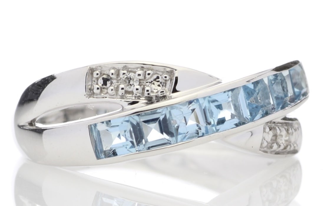 This Twist On A Classic Ring Is Stunning. Seven Beautiful Princess Cut Blue Topaz Gemstones - 4
