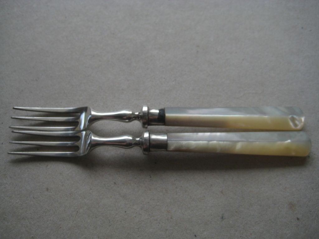 Antique Pair of Mother of Pearl Hafted Silver Plated Pickle Forks: Title: Antique Pair of Mother of Pearl Hafted Silver Plated Pickle Forks Description: Antique Pair of Mother of Pearl Hafted Silver Plated Pair of Pickle Forks. Length in Inches is