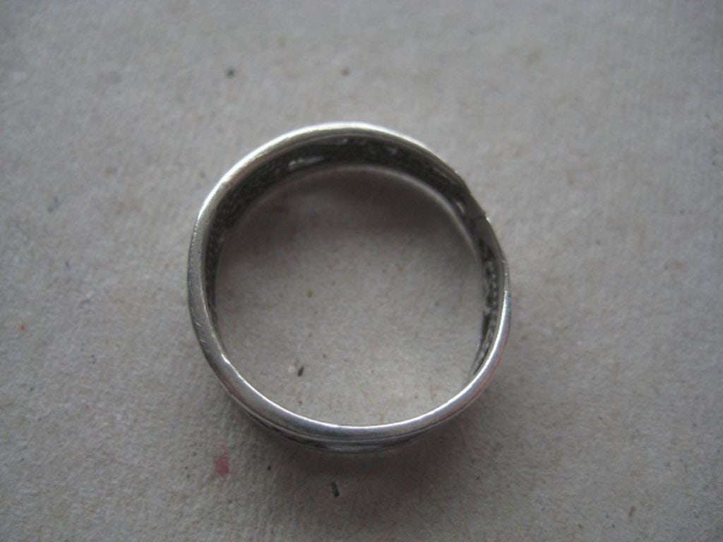 Antique White Metal Pierced Floral Ring: Title: Antique White Metal Pierced Floral Ring Description: Antique White Metal Pierced Floral Ring. Diameter is 0.75 Inches. Weight is 1.7 Grams. Condition: Good. Condition: