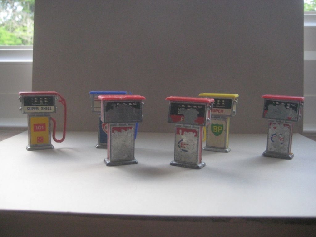 A Group of Six Vintage Metal Miniature Petrol Pumps: Title: A Group of Six Vintage Metal Miniature Petrol Pumps Description: A Group of 6 Vintage Metal Miniature Petrol Pumps. Condition: Used, Plenty of Wear. Height is 1.75