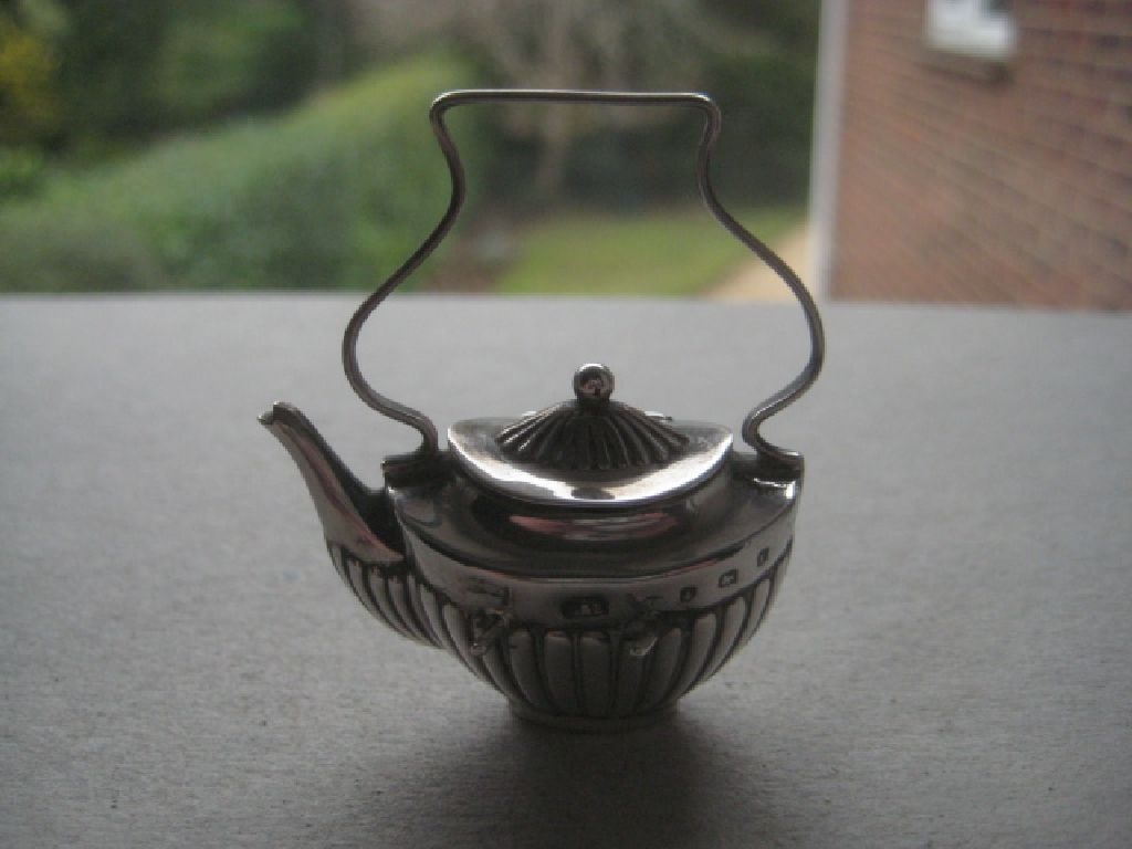 Antique Miniature Silver Fireside Kettle, Birmingham 1905: Title: Antique Miniature Silver Fireside Kettle, Birmingham 1905 Description: Antique Miniature Silver Fireside Kettle. Hallmarked for Birmingham 1905. Height is 2 Inches.